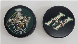 Lot of 2 Jason Zucker & Charlie Coyle Autographed Minnesota Wild Hockey Pucks