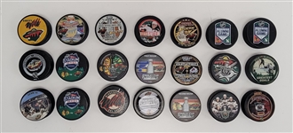 Lot of 21 Minnesota Wild Commemorative Hockey Pucks