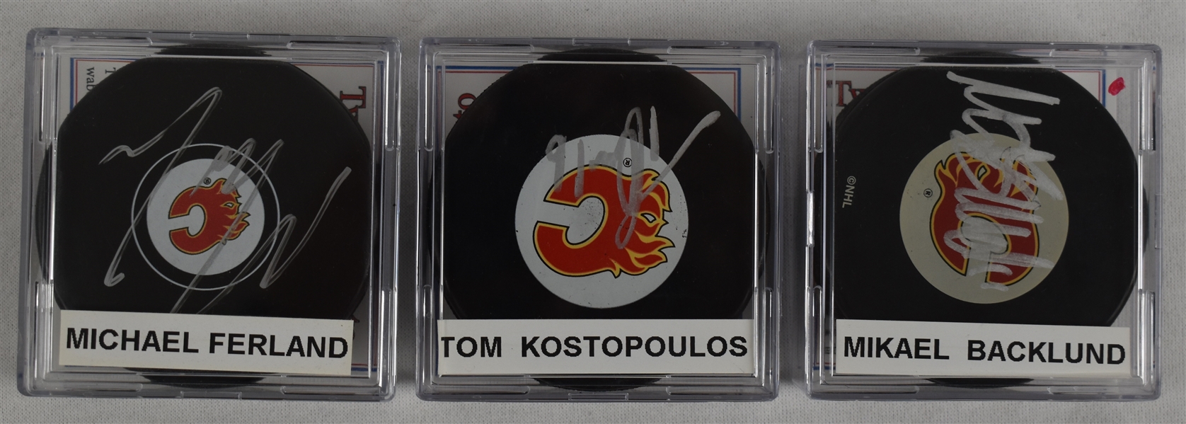 Backlund Ferland & Kostopoulos Lot of 3 Autographed Hockey Pucks w/Case