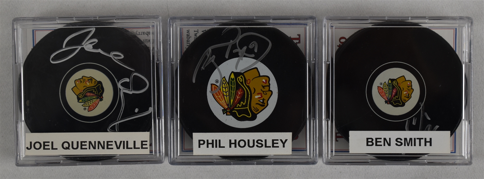 Housley Quenville & Smith Lot of 3 Autographed Hockey Pucks w/Case