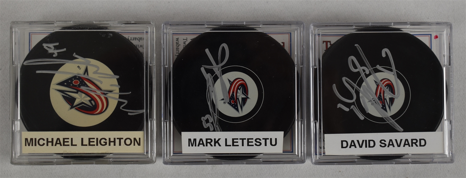Leighton Letestu & Savard Lot of 3 Autographed Hockey Pucks w/Case