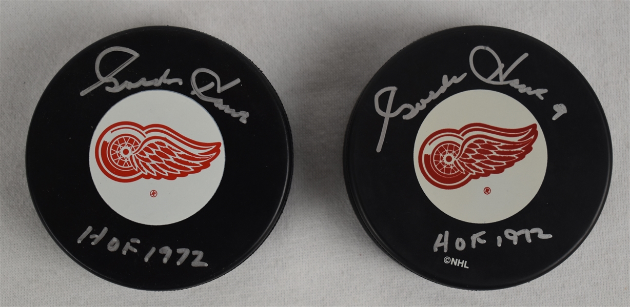 Gordie Howe Lot of 2 Autographed Hockey Pucks