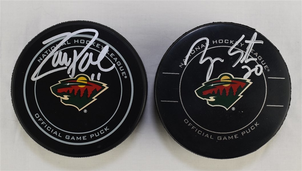 Zach Parise & Ryan Suter Autographed Hockey Pucks