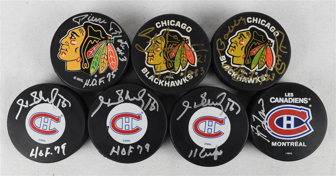 Collection of 7 Autographed Hockey Pucks w/Bobby Hull & Henri Richard