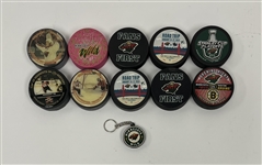Collection of Minnesota Wild Commemorative Hockey Pucks