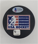 Herb Brooks, Mike Eruzione, & Jim Craig Autographed USA Hockey 1980 Puck w/ Beckett LOA