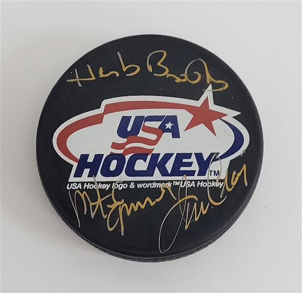 Herb Brooks, Jim Craig, & Mike Eruzione Autographed USA Hockey Puck w/ Beckett LOA