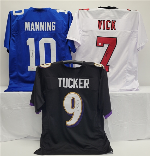 Lot of 3 Eli Manning, Justin Tucker, & Michael Vick Autographed Custom Jersey