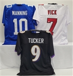 Lot of 3 Eli Manning, Justin Tucker, & Michael Vick Autographed Custom Jersey