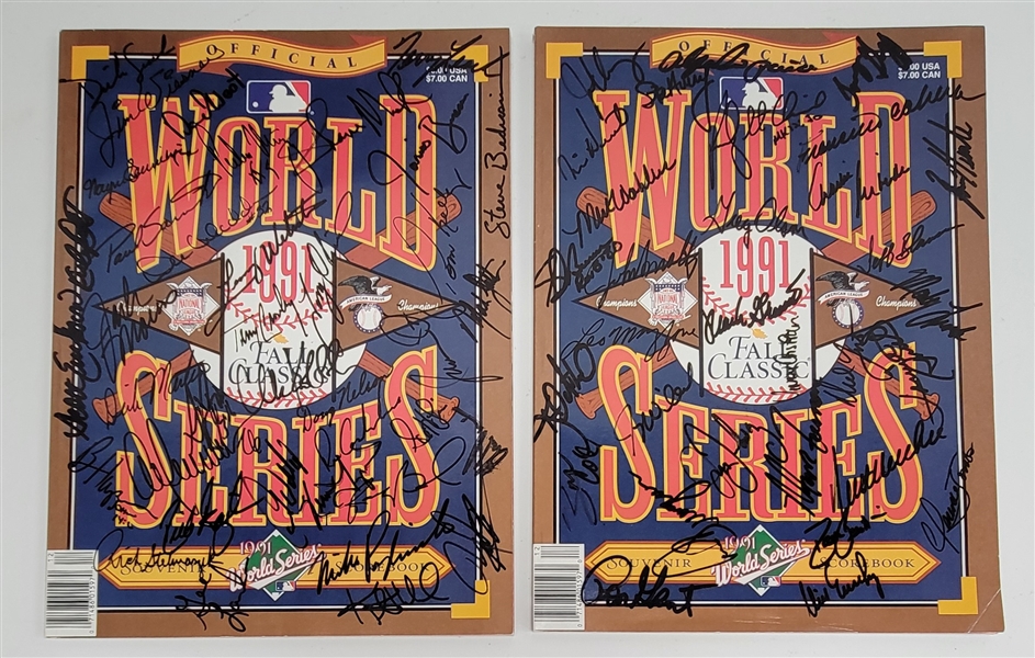 Lot of (2) Minnesota Twins & Atlanta Braves Team Signed 1991 World Series Scorebooks w/ Beckett LOAs