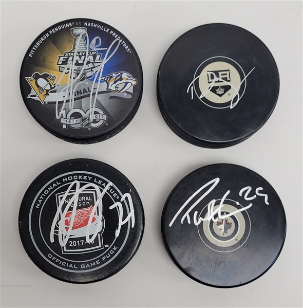 Lot of 4 Matt Murray, Dylan Larkin, Drew Doughty, & Patrik Laine Autographed Hockey Pucks JSA