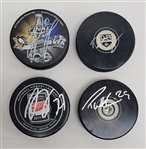 Lot of 4 Matt Murray, Dylan Larkin, Drew Doughty, & Patrik Laine Autographed Hockey Pucks JSA