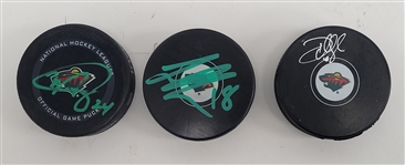 Lot of 4 - Minnesota Wild Autographed Hockey Pucks & Glove Beckett