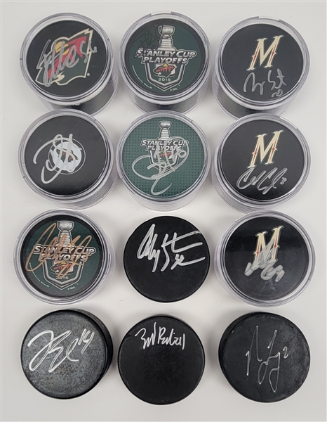 Lot of 12 Minnesota Wild Autographed Hockey Pucks